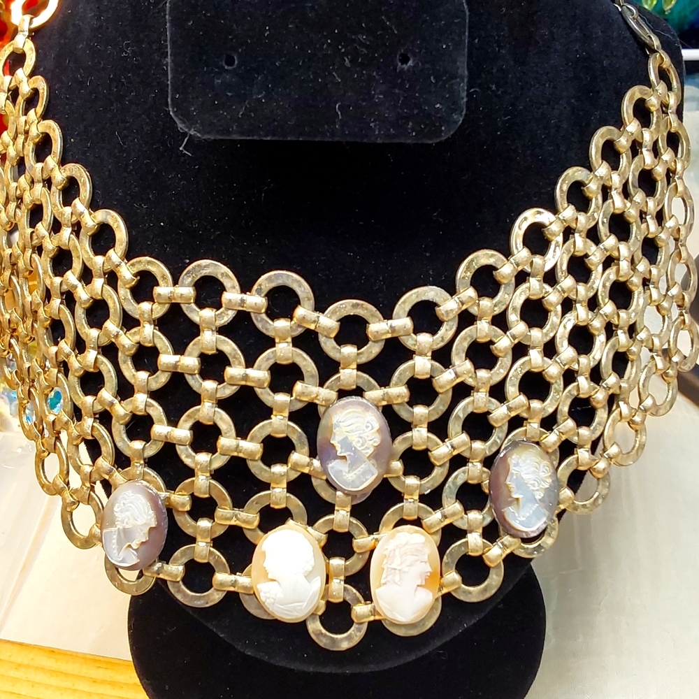 A family affair, gold tone necklace multiple multiple cameos.